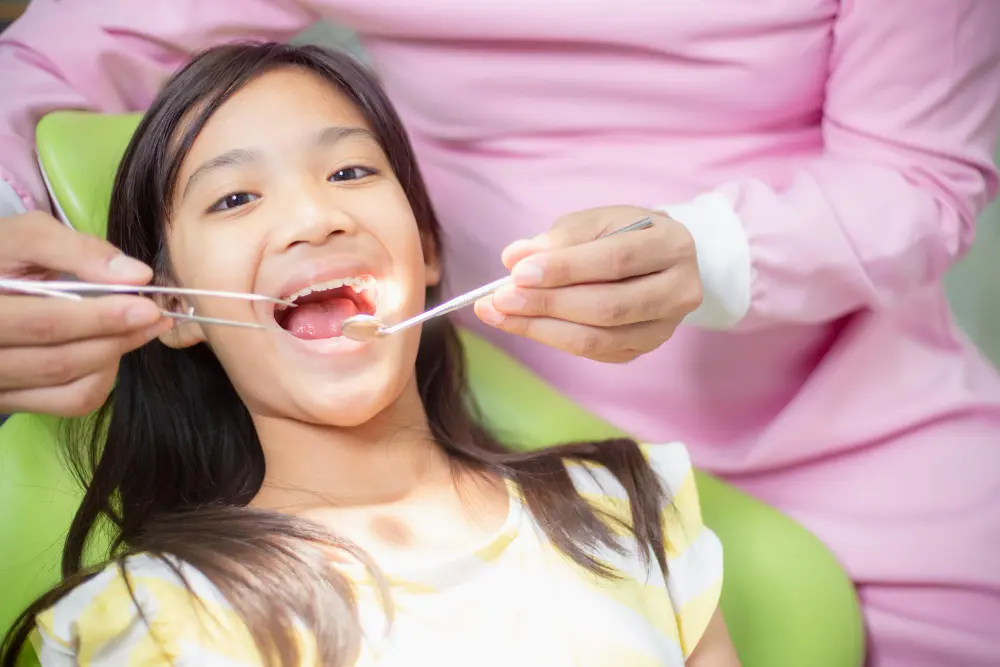 a girl with a tool in her mouth