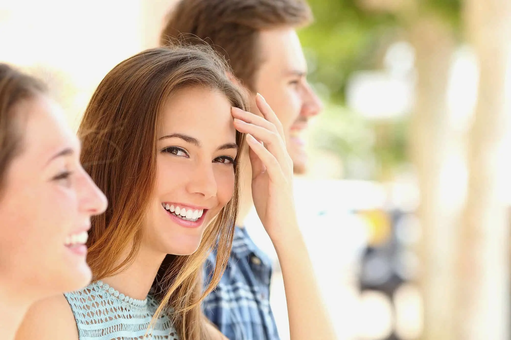 Smiling young adults with confident smiles after orthodontic treatment at Limestone Hills Orthodontics in Austin, TX, experts in Herbst Appliance care.
