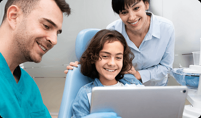 Young patient with dental professional discussing appointment duration at Limestone Hills Orthodontics, Austin, TX