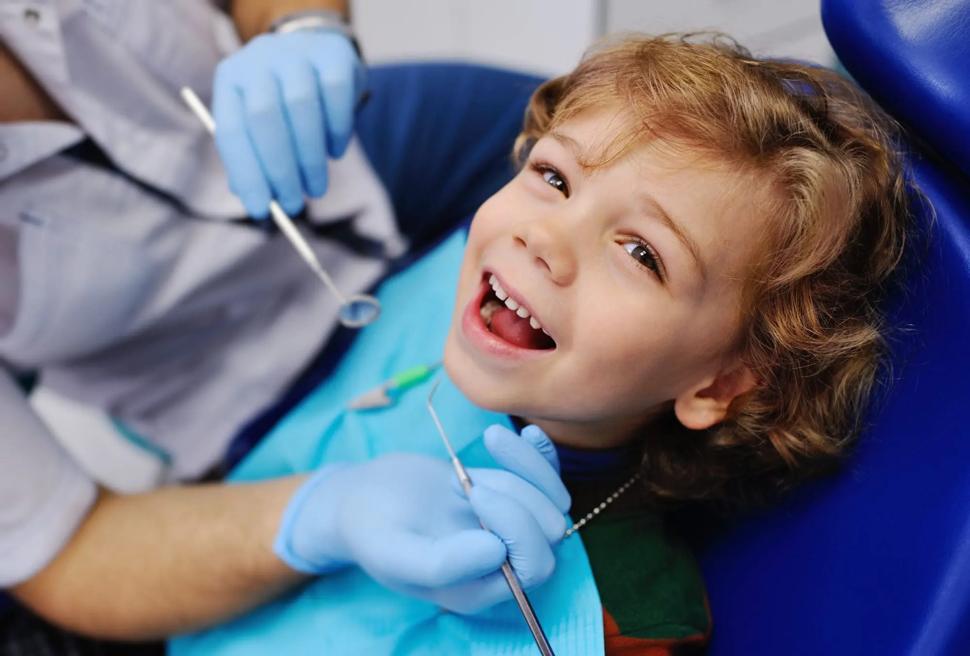 Smiling child during dental exam at Limestone Hills Orthodontics, Austin TX – Give Your Child a Lifetime of Smiles