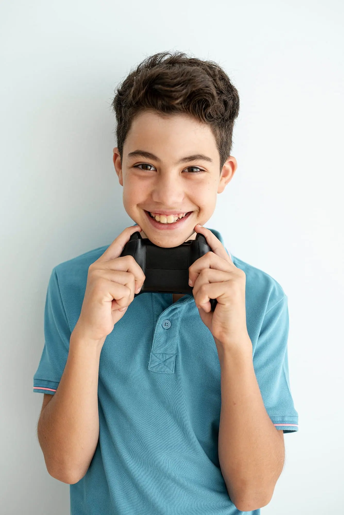 Teenage boy smiling while learning about overbite, underbite, and crossbite at Limestone Hills Orthodontics, Austin, TX