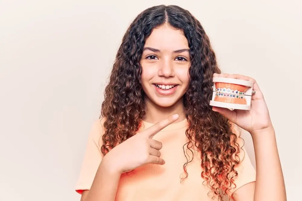 Young woman smiling at Limestone Hills Orthodontics in Austin, TX, showing affordable braces cost in Austin.